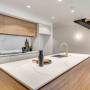 White walls in stylish kitchen brighten cooking space