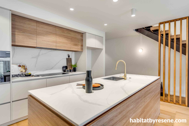 White walls in stylish kitchen brighten cooking space