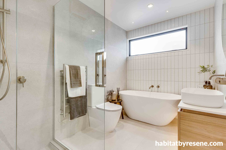 White tones painted on walls and ceiling creates enchanting space in this powder room