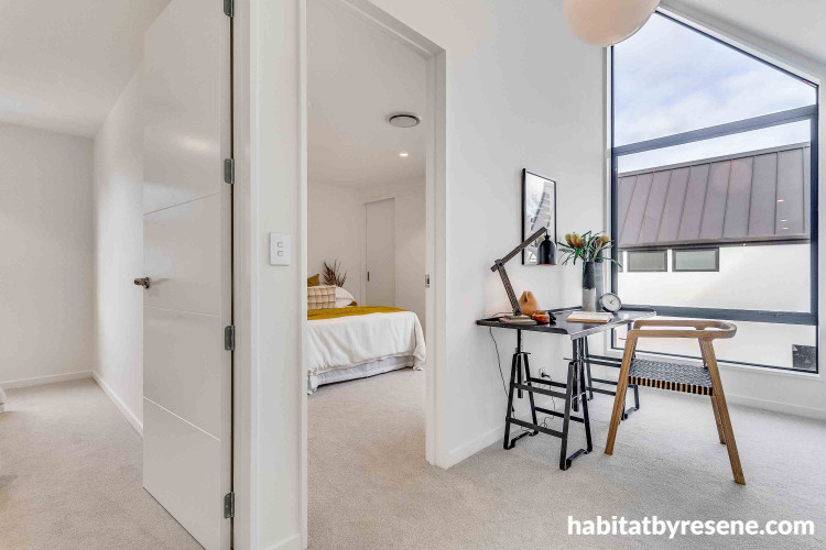 Study space is elevated by white tone on walls and trims