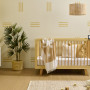 Bright & playful nursery painted in bright yellow tones