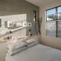 Bedroom featuring concerte panels and painted in Resene White Pointer