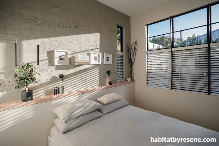 Bedroom featuring concerte panels and painted in Resene White Pointer