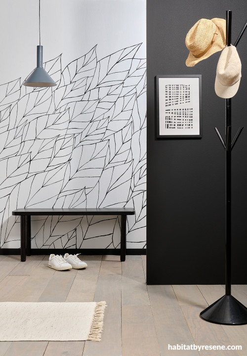 Monochromatic entryway painted in Resene Half Black White and Resene Nero