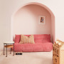 Living area featuring walls painted in soft pink Resene Contented