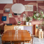 Dining room with mural painted in Resene Summer Rose and Savour