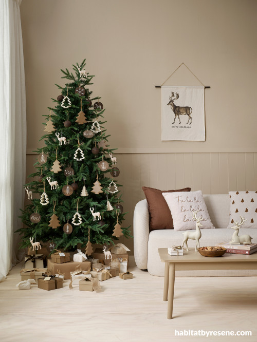 Living room featuring Christmas design in rustic, natural tones