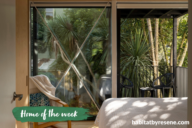 Bedroom with stained exterior posts and framing