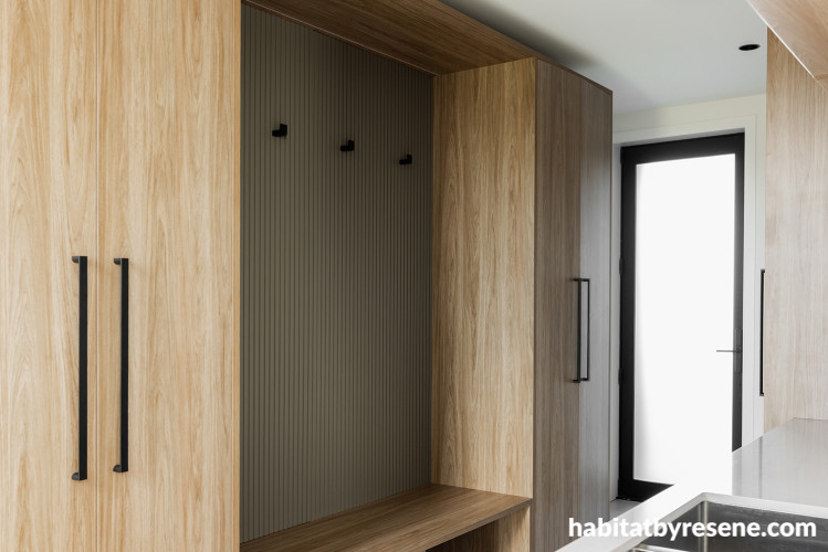 Utility space featuring wood finish and black hardware