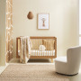 A nursery with giraffe wall pattern