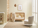 A nursery with giraffe wall pattern