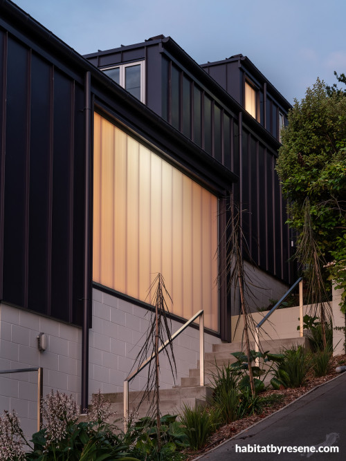 An illuminated stairwell in a dark house