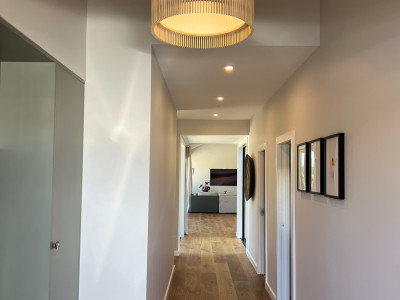 Warm neutrals and blush hues bring this Oratia home to life