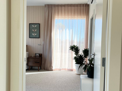 Warm neutrals and blush hues bring this Oratia home to life Warm neutrals and blush hues bring this Oratia home to life