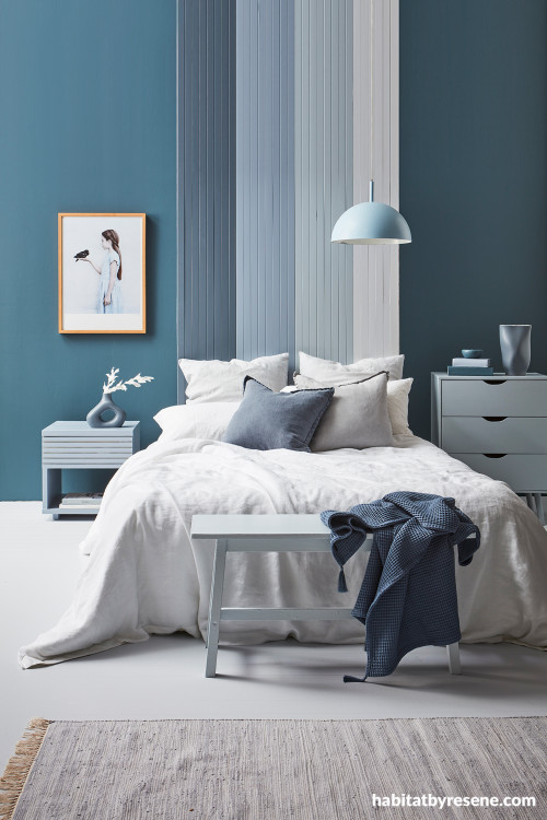 Blue bedroom with feature wall painted in Resene Rhino