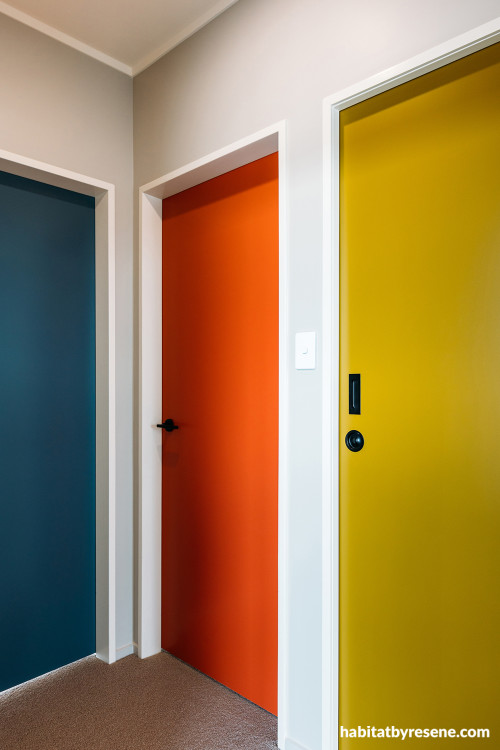 Apartment doorways featuring mid-century inspired colours