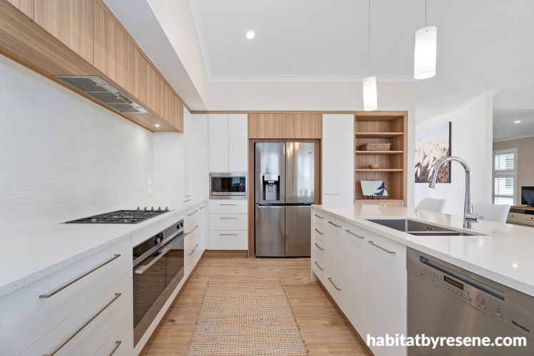 Neutral and timber kitchen featuring cabinets painted in Resene Double Alabaster and walls in Resene Quarter Sandspit Brown