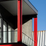 House exterior featuring vivid red Resene Poppy and black wall cladding in Resene Ebony