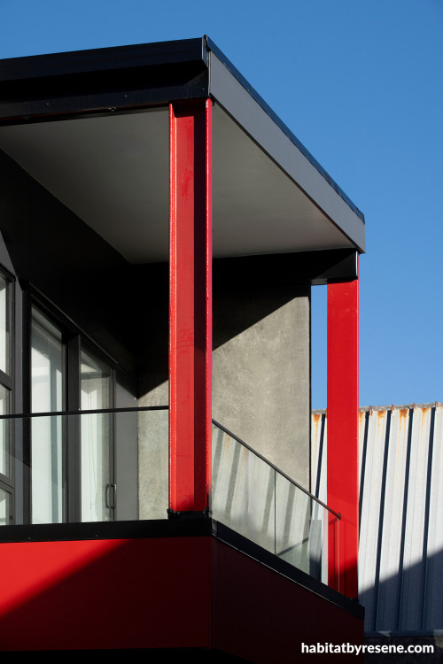 House exterior featuring vivid red Resene Poppy and black wall cladding in Resene Ebony