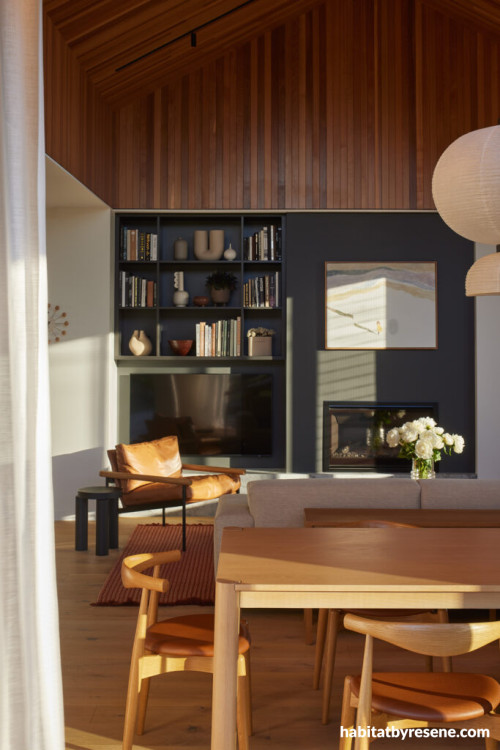 Dining area with fireplace in Resene Porter
