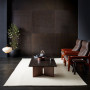 Living space featuring black walls and floor