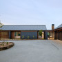 House exterior by Signature Homes featuring brickwork in Resene Bokara Grey