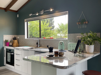 An 80s-build gets a colour injection with Resene Indian Ink and Resene Green Meets Blue in an interior designer’s own home