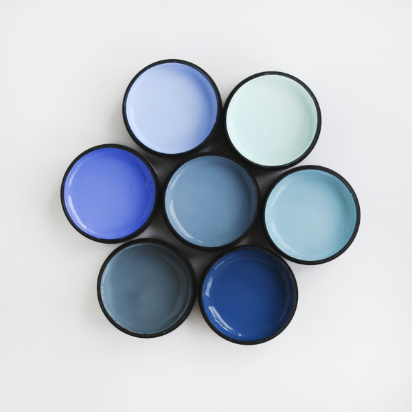Middle testpot in Resene Undercurrent. Testpots clockwise from left in Resene Danube Resene Aqua Resene Retreat Resene Prussian Blue Resene Atomic and Resene Half Resolution Blue