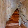 Stairwell, staircase featuring timber floors and walls