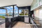 Dark blue kitchen painted in Resene Wild Blue Yonder