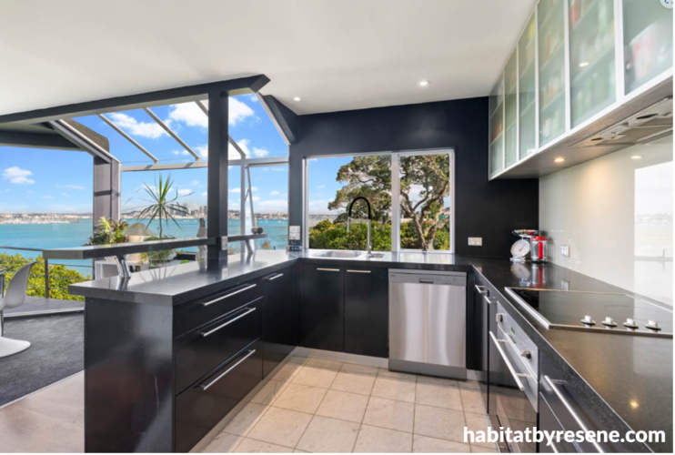 Dark blue kitchen painted in Resene Wild Blue Yonder