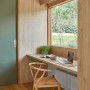 Workspace with timber walls and a door painted in Resene Double Lemon Grass