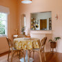 Dining room with walls painted in soft peachlike apricot