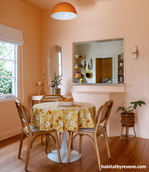 Dining room with walls painted in soft peachlike apricot