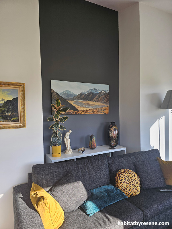 Living room with earthy white and grey walls.