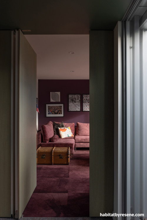 Hallway and family room panted in vibrant burgundy Resene Aubergine