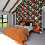 Master bedroom with feature wall featuring bold floral wallpaper