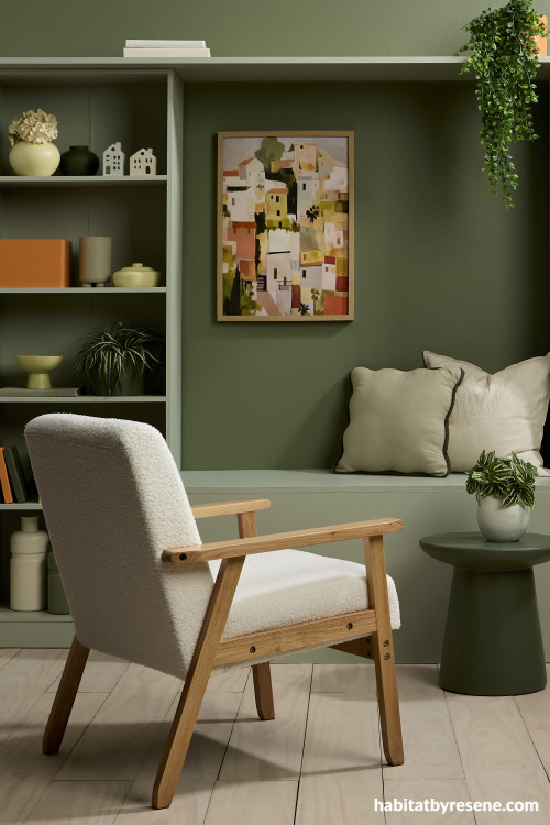Reading nook featuring earthy green walls