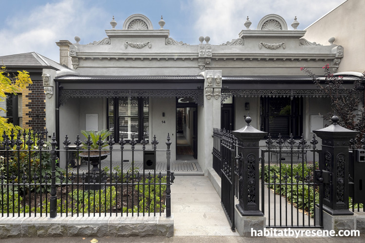 A home with a black painted fence