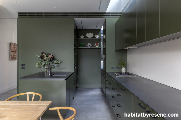 A dark green kitchen