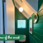 Once dark and dim, the toilet is now modern and bright, painted in Resene Fun Green with Resene Quarter Rice Cake on doors and Resene Ceiling Paint White on the ceiling