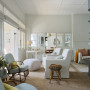 Light pours into lounge with white walls