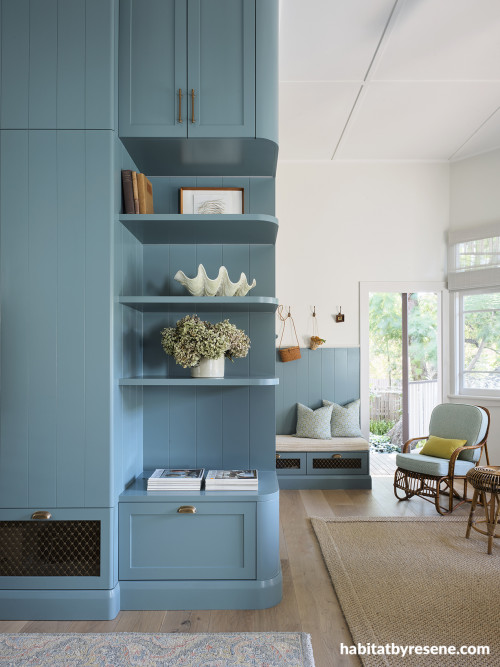 Fun curved joinery in home painted blue