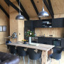 Kitchen, kitchen featuring natural timber walls and Resene Black