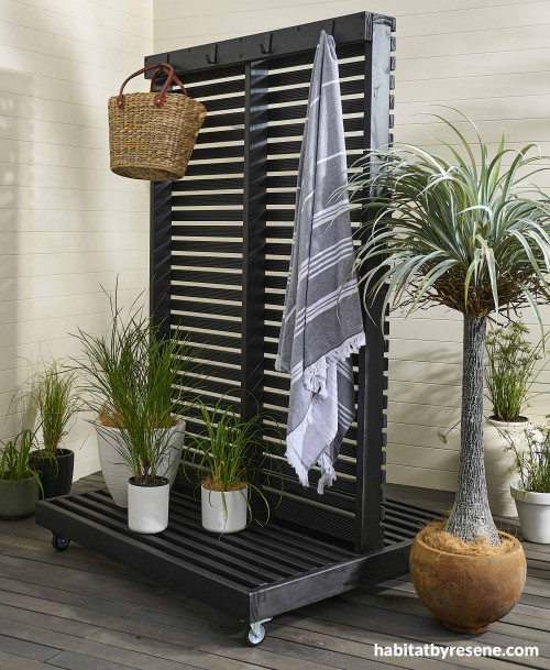 Dark dividing screen for using on outdoor deck or patio