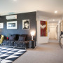 displaying art, black interiors, living trends, hallway, paint trends
