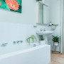 bathroom, white bathroom, floral artwork, indoor plants, botanical theme