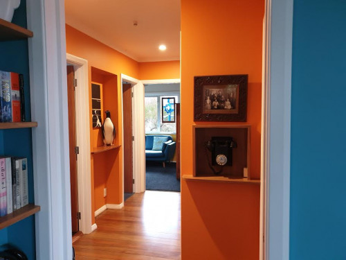 hallway, orange hallway, orange interior, blue and orange interior, resene tango, bright hallway