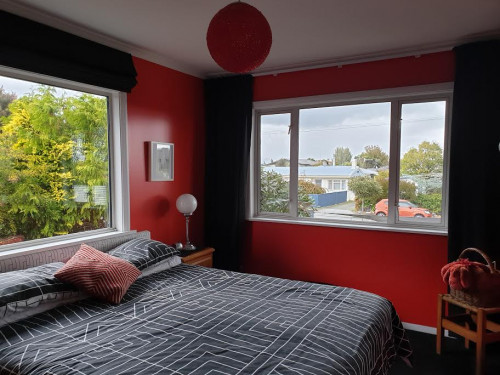 bedroom, red bedroom, master bedroom, red interior, red feature wall, bright bedroom