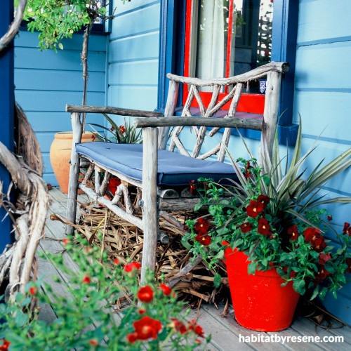 painted exterior, front deck, blue paint, red paint, colourful exterior